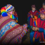 Andean priest and people in ceremony to the Pachamama 