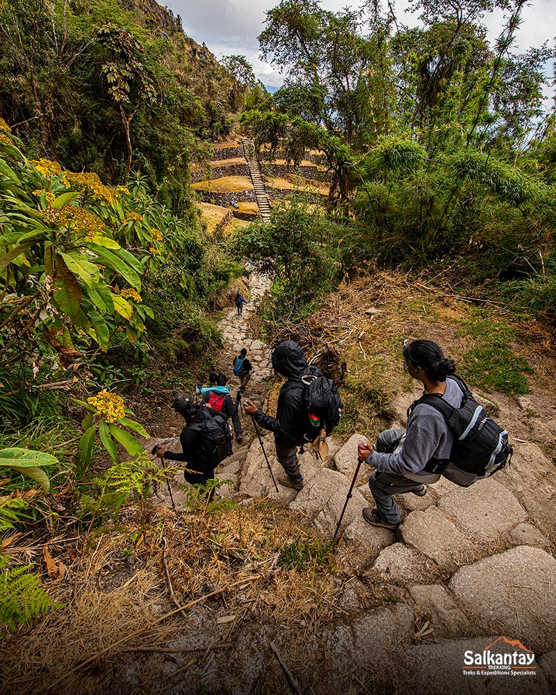 Tourists descending to the archaeological site of Phuyupatamarca, the citadel on top of clouds