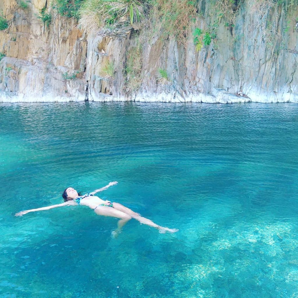 Woman swimming at hot spring