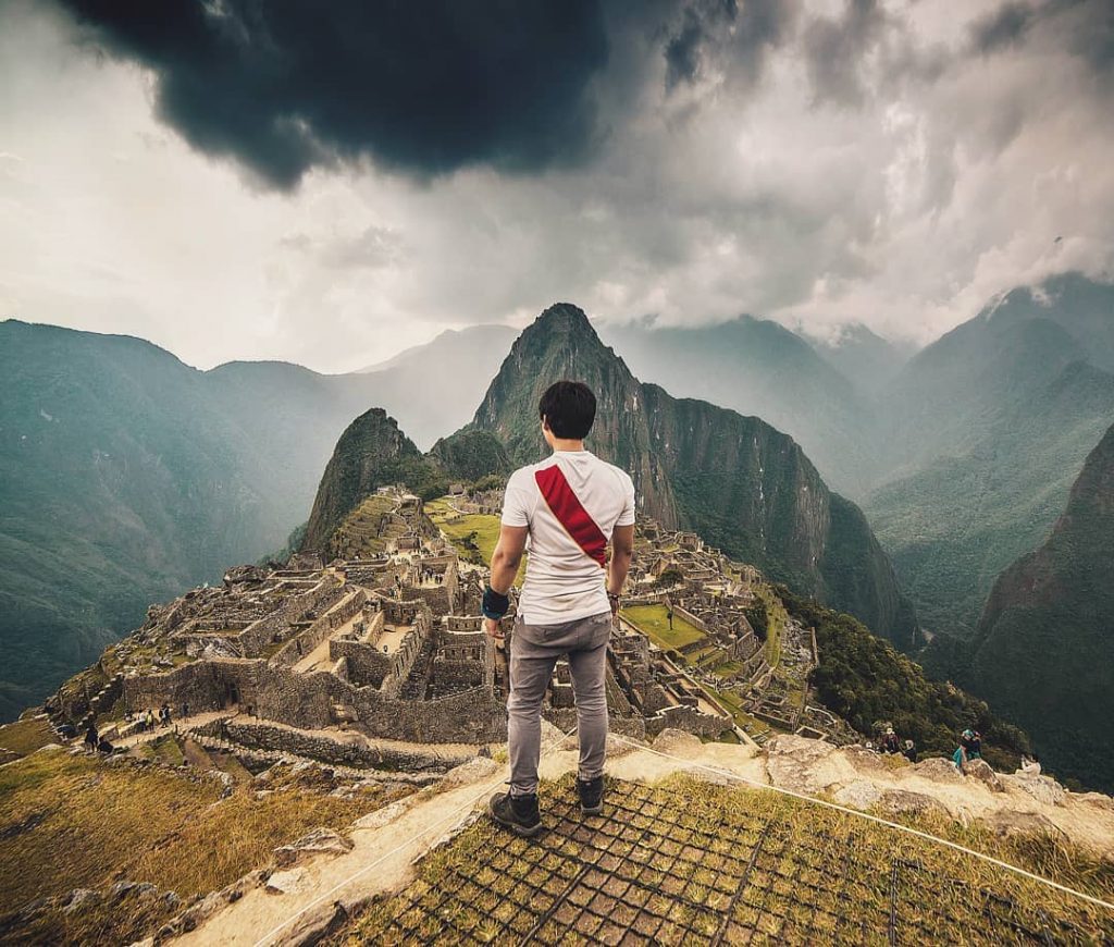 Man watching Machu Picchu