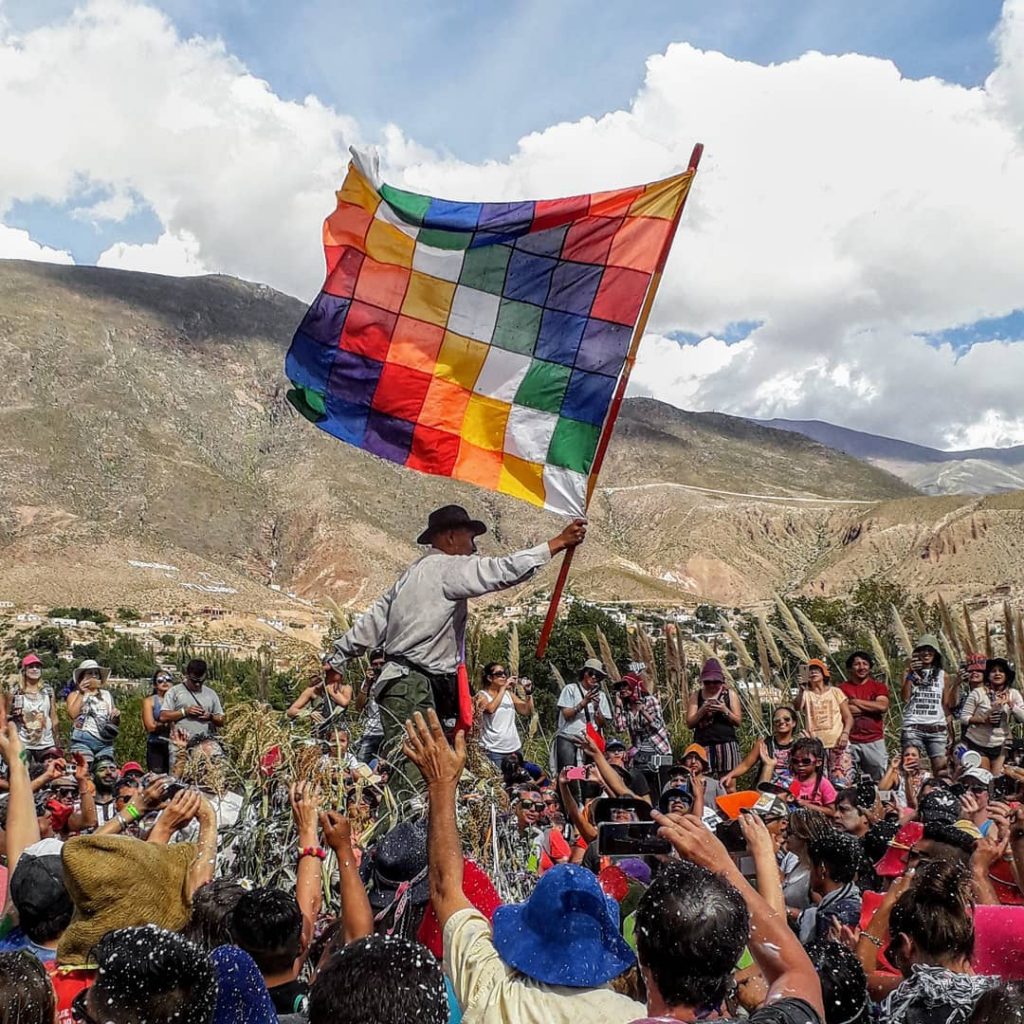  Wiphala holding by a man in Bolivia