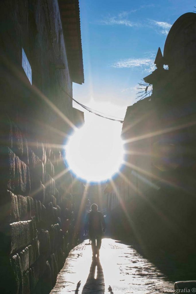 The sun illuminating the streets of Cusco