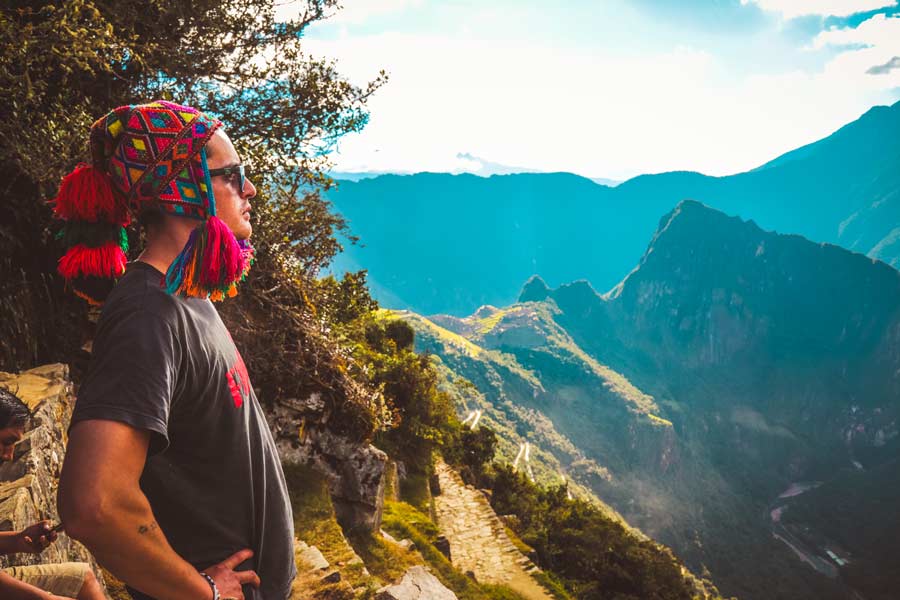 Tourist watching Machu Picchu from Sun gate