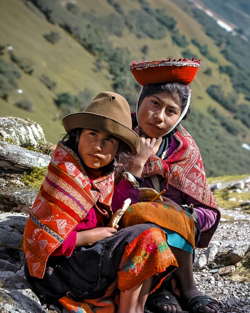 Two Andean girls in their traditional clothing on the Lares route.