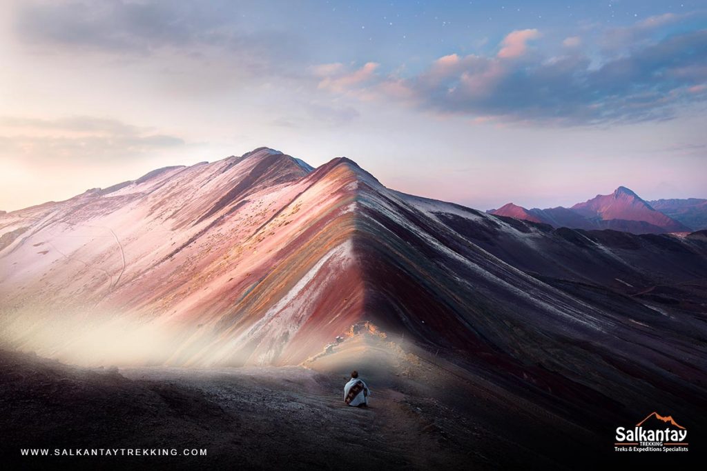 Panoramic view of the rainbow mountain with a tourist