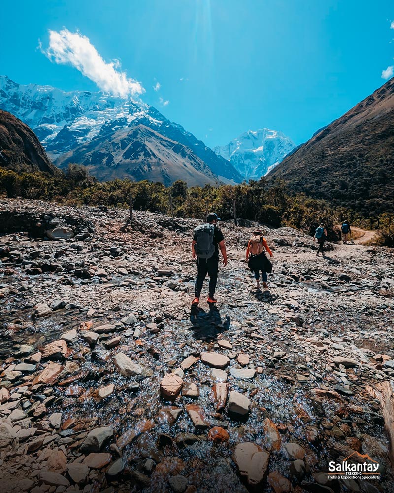 Tourists walking towards Salkantay and Humantay Mountains