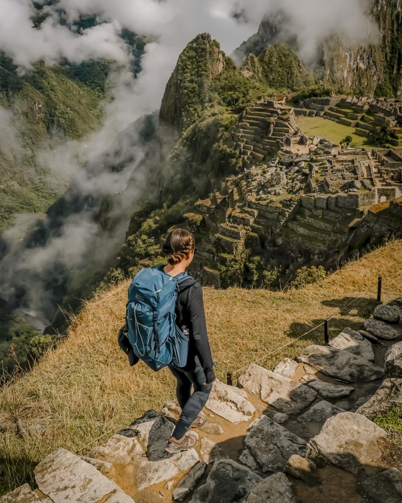 Tourist walking in Machu Picchu archaeological site