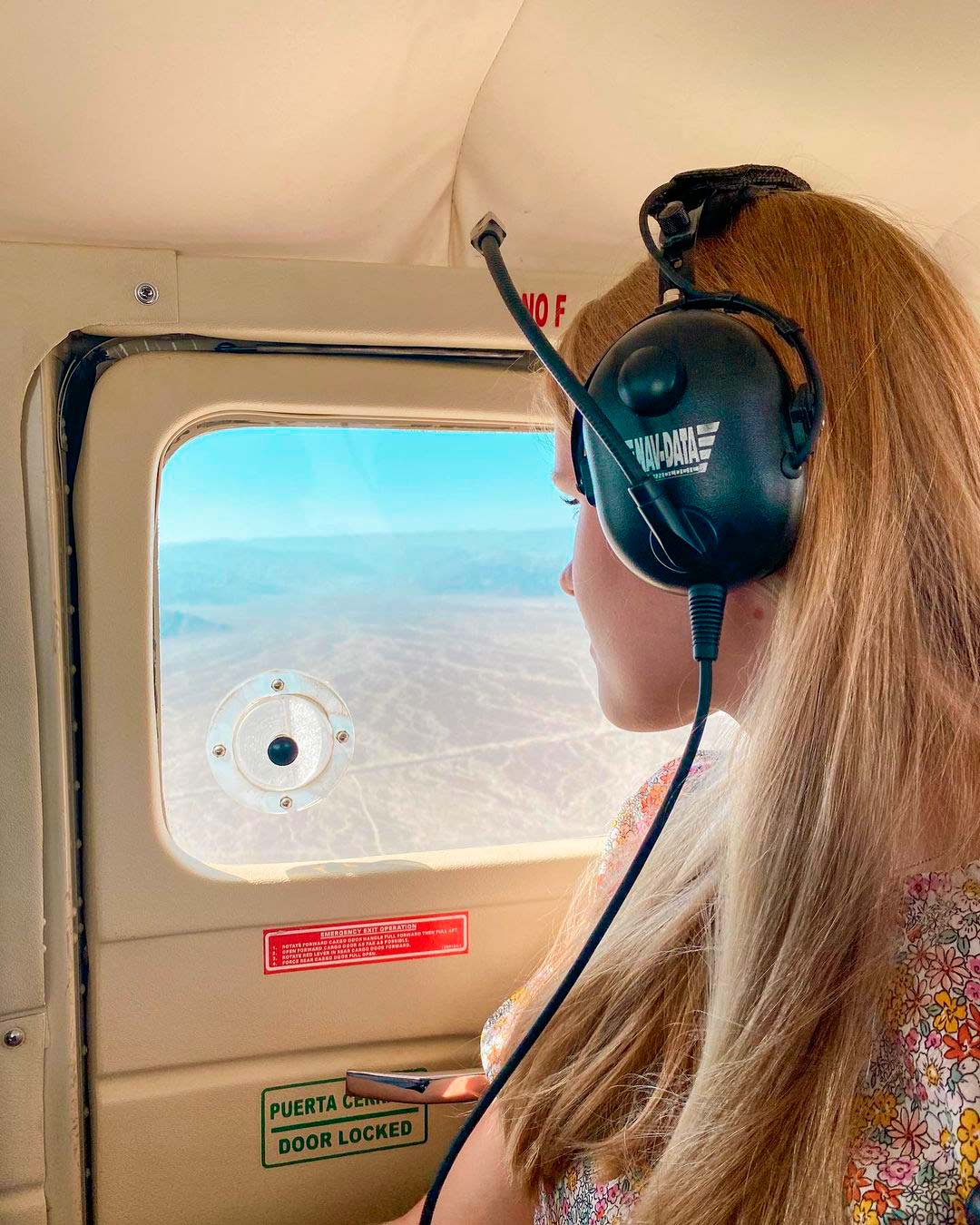 Girl watching Nazca lines from aircraft