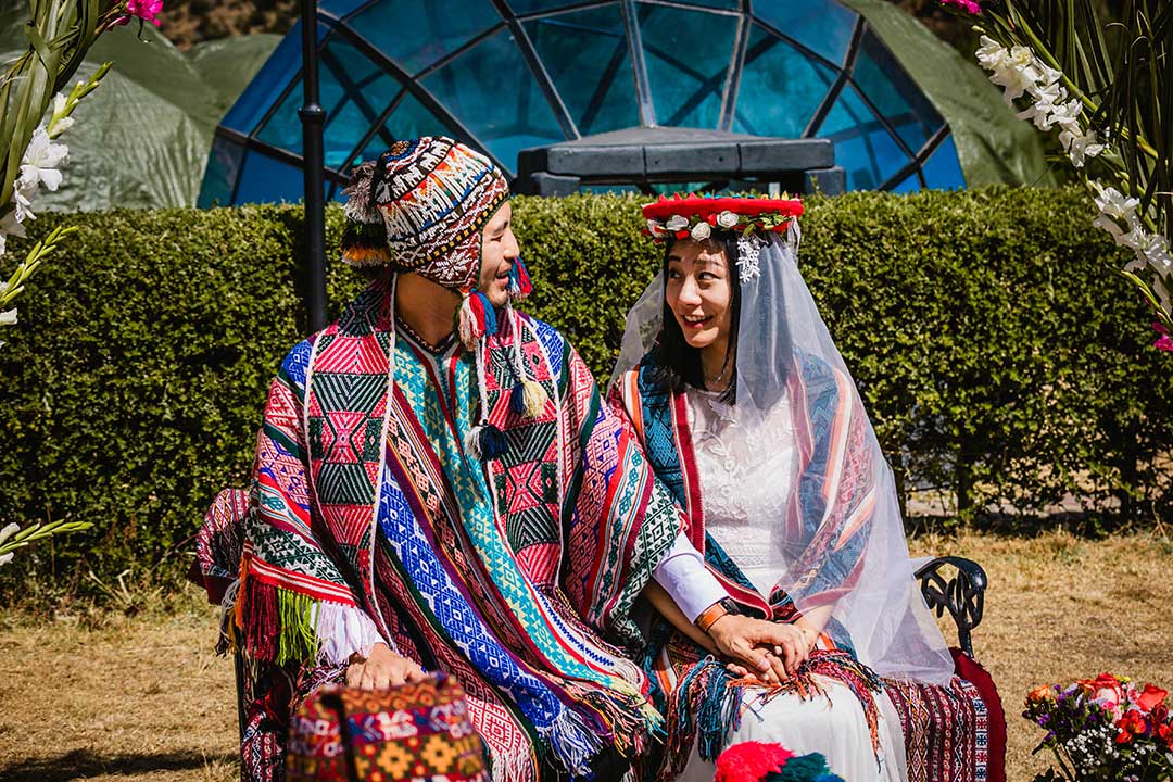 Newlywed couple with typical costumes of the Peruvian highlands at the camp Sky Camp in Soraypampa