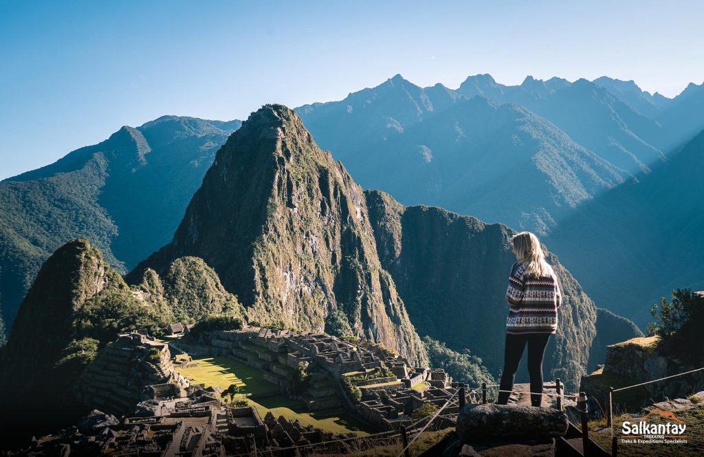 a woman in macchhu picchu