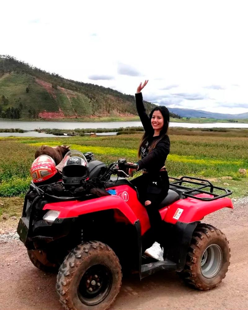 happy woman in an ATV at the sacred valley of cusco