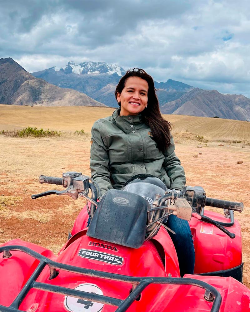 happy woman posing for a pic inside in an ATV at the sacred valley of cusco
