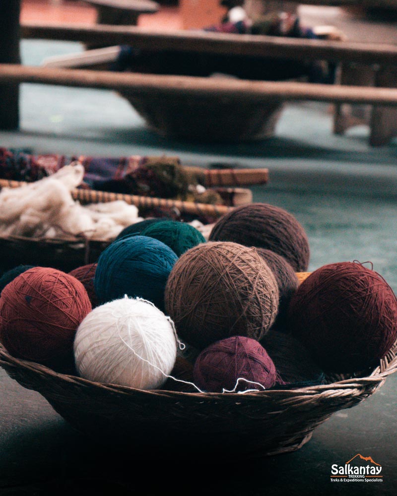 Wools from local animals are washed, spun, and dyed with the natural plant materials