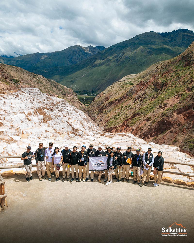 Group of guides in the salt mines of Maras