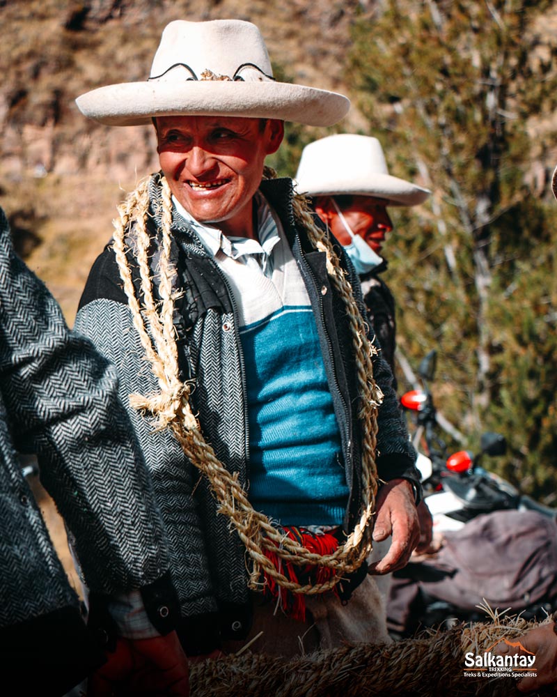 Andean person building the Q'eswachaka bridge