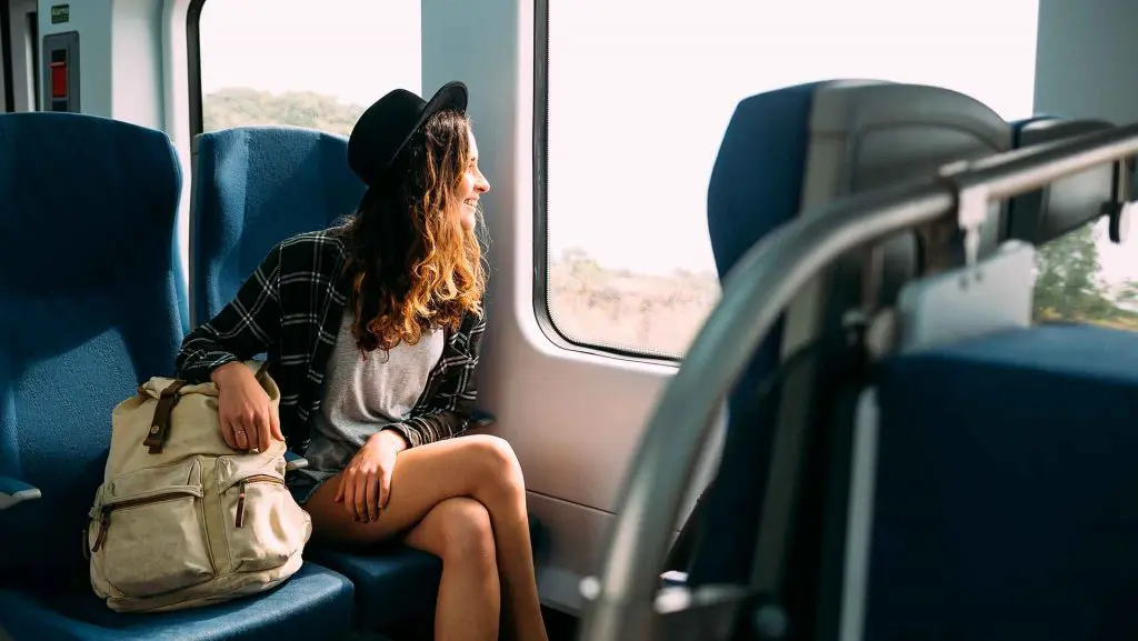 woman traveling by train in peru