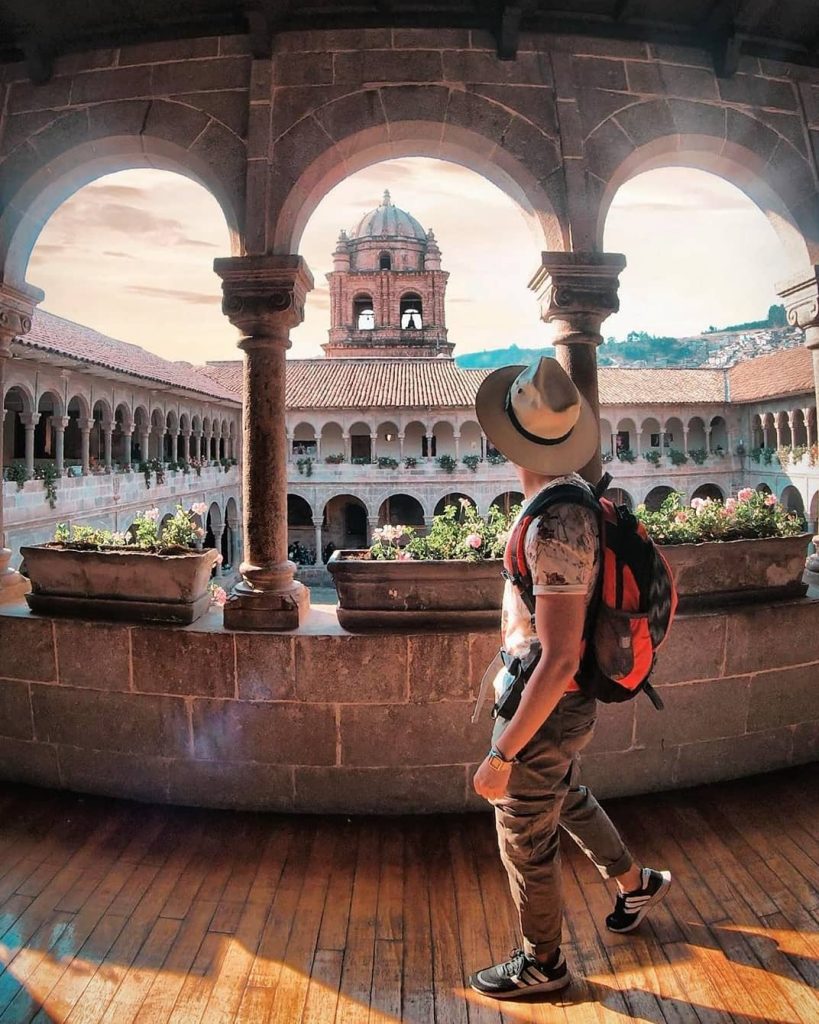 A man in a Temple of Qoricancha, Cusco. Most instagrammable places in Cusco.