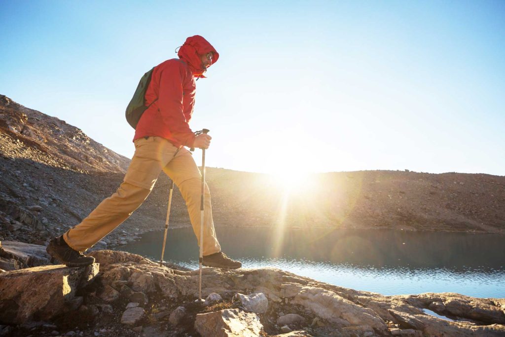 Man hiking at a lake in Cusco, Peru