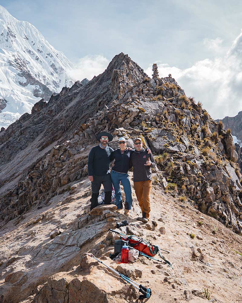 Group taking a photograph on the Salkantay Pass, trekking