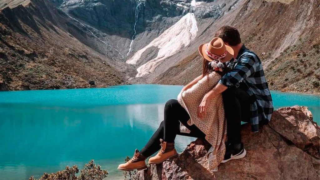 COUPLE ENJOYS THE VIEW OF HUMANTAY LAGOON, CUSCO