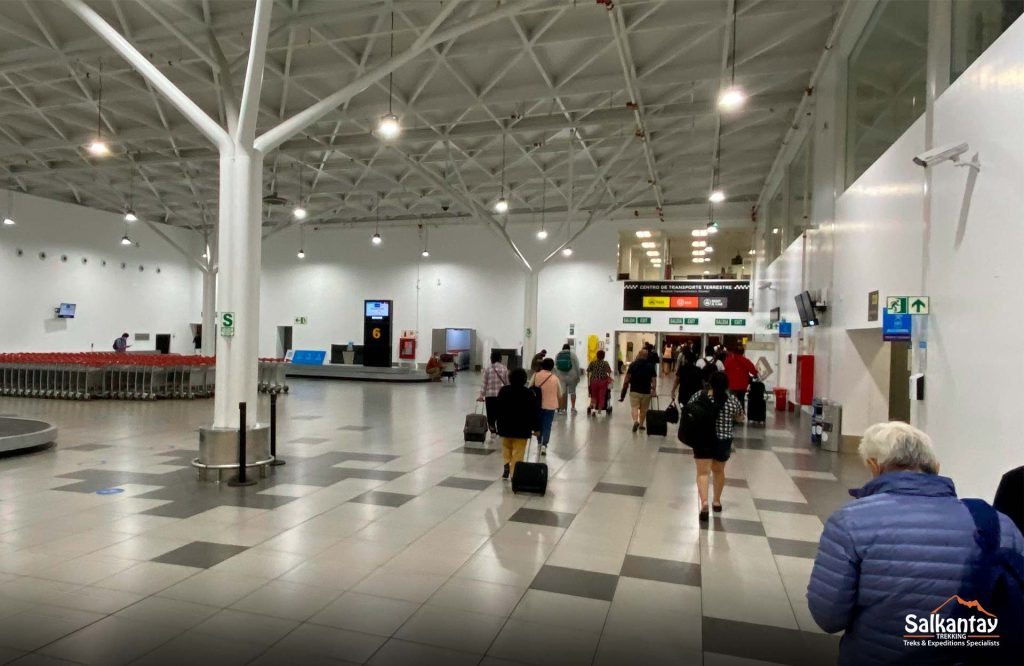 Picture of people traveling at the airport with suitcases