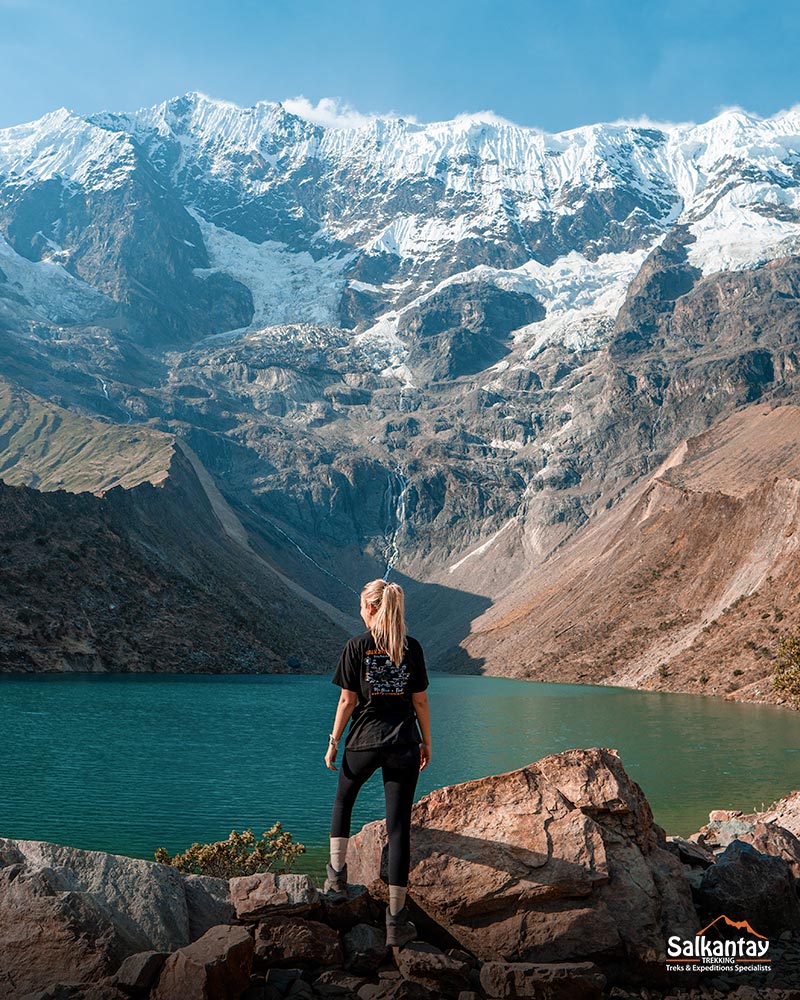 Tourist seeing the Humantay lake in the Andes of Peru