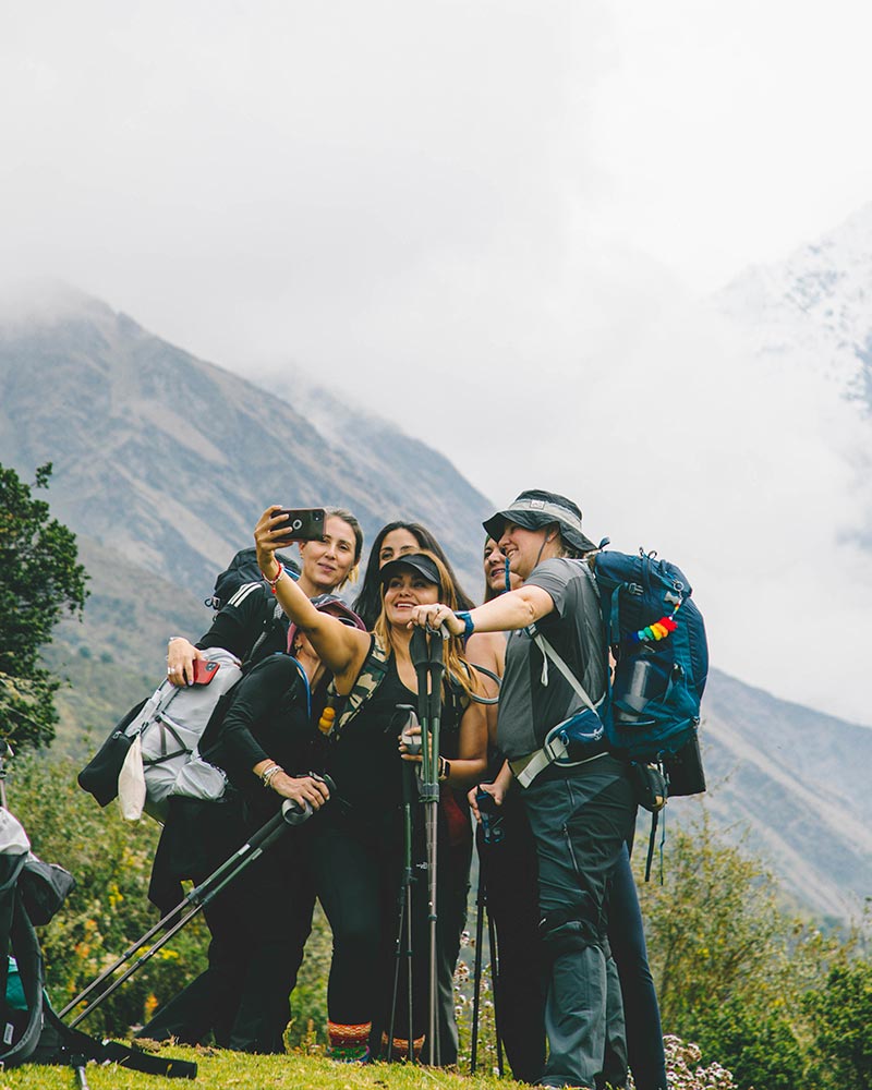 Image of a group of women taking a selfie in the mountains.