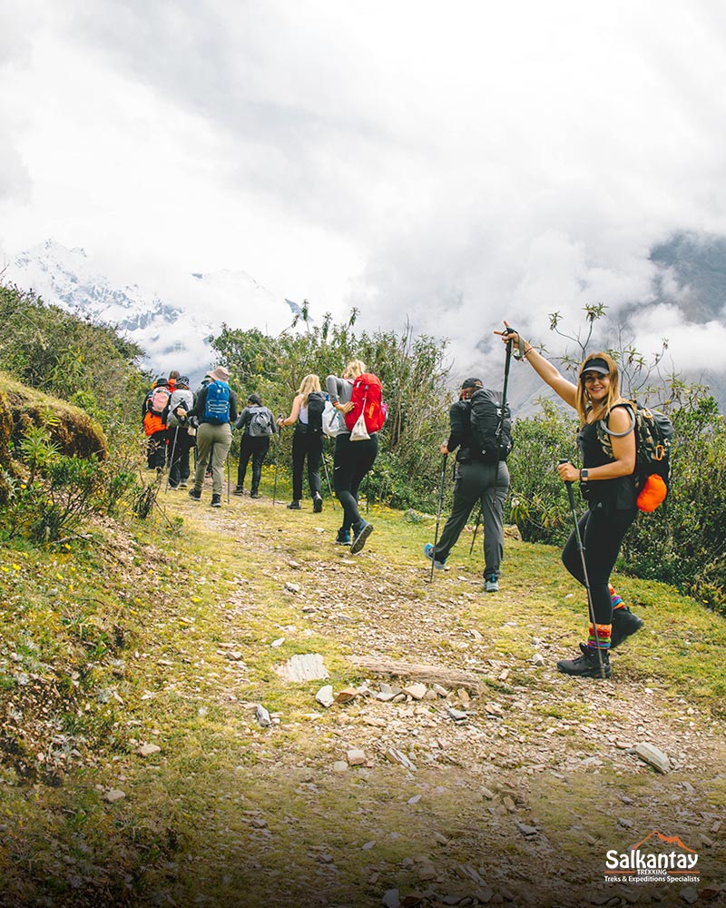 Image of women trekking through the mountains