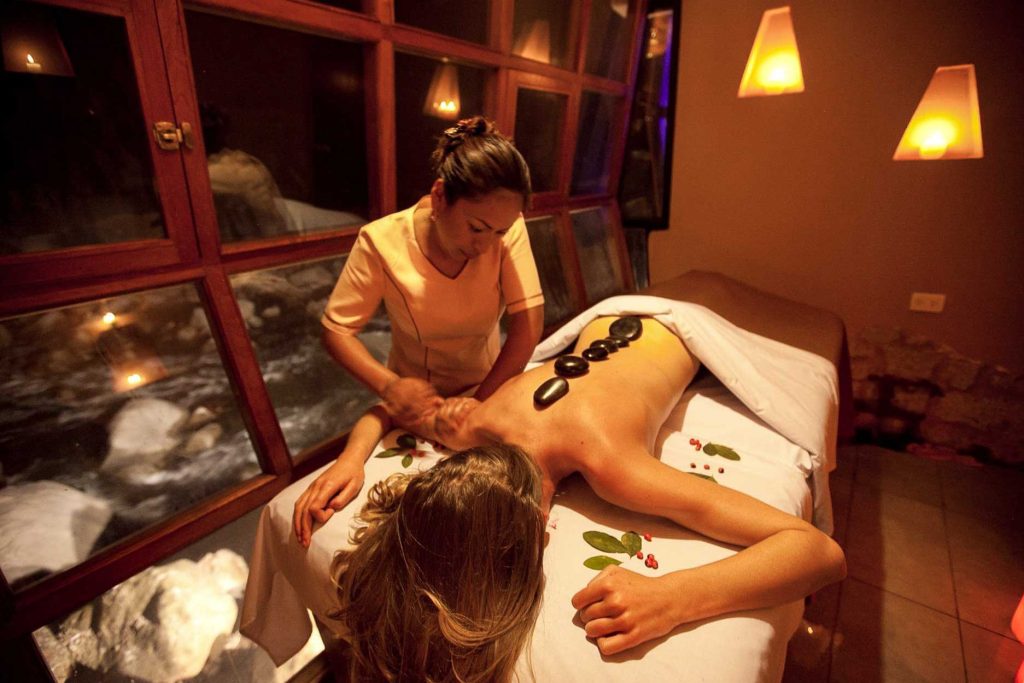 A woman getting a massage at a spa in Cusco