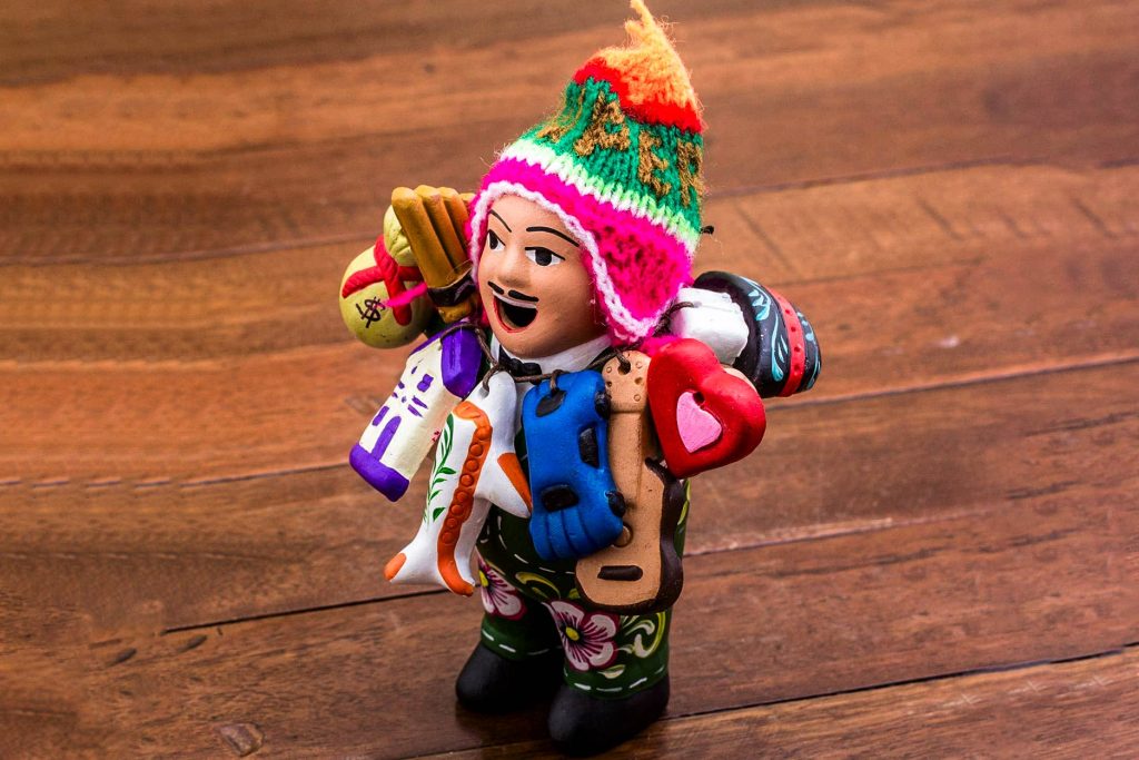 Ekeko, a figure of good luck in Peru, wearing traditional Cuizco clothing.