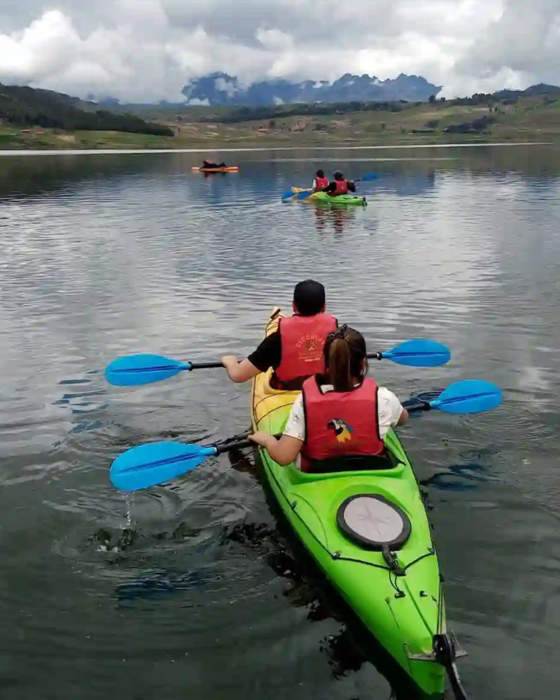 People in a boat on the Huaypo lagoon