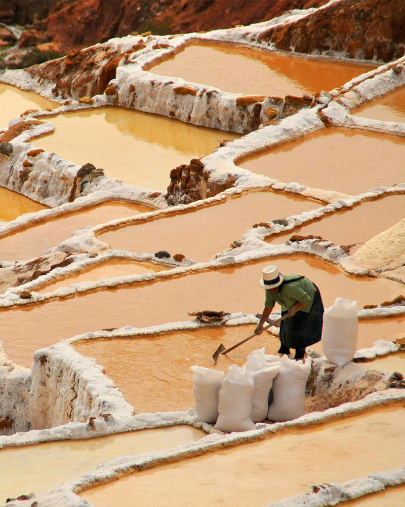 Woman extracting salt from Maras