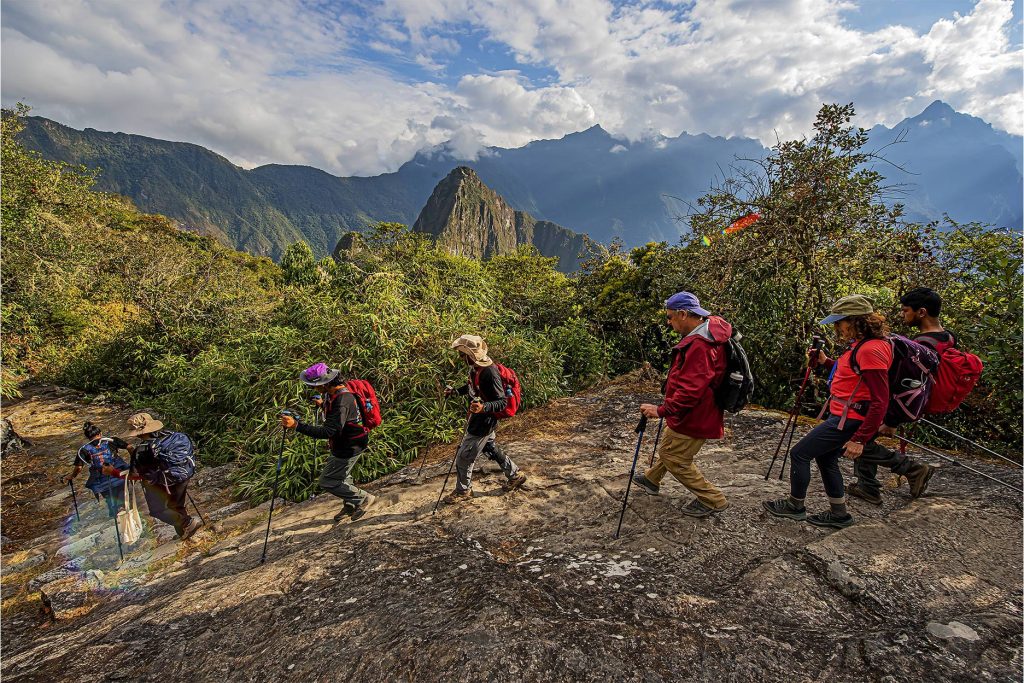 people arriving at Machu Picchu via the Inca Trail