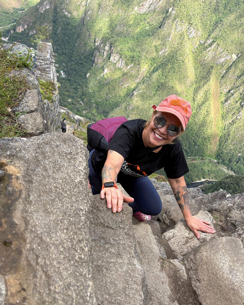 Woman on the stairs of death Huayna Picchu
