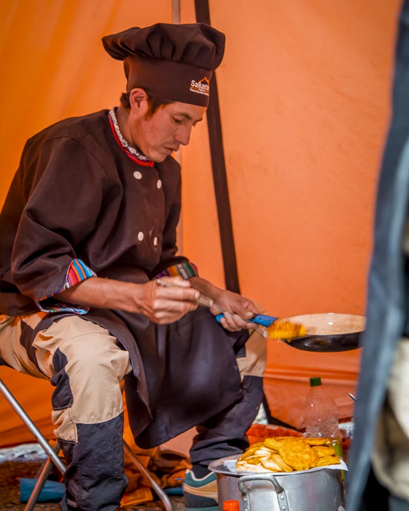 A cook cooking on the Inca Trail route
