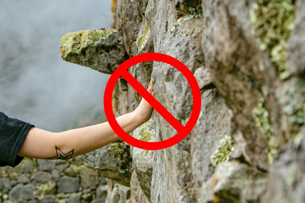 Not touching the Inca walls of Machu Picchu