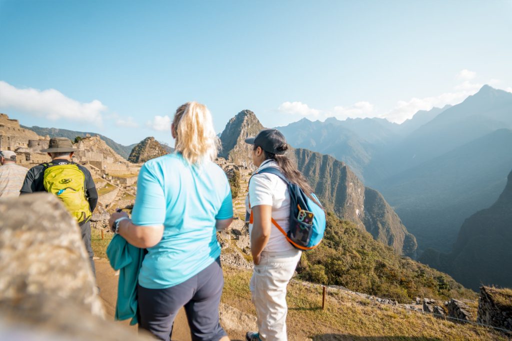 Tourists visiting Machu Picchu in groups
