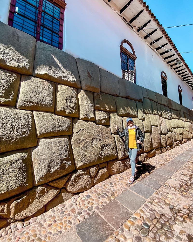Tourist next to the 12-angled stone