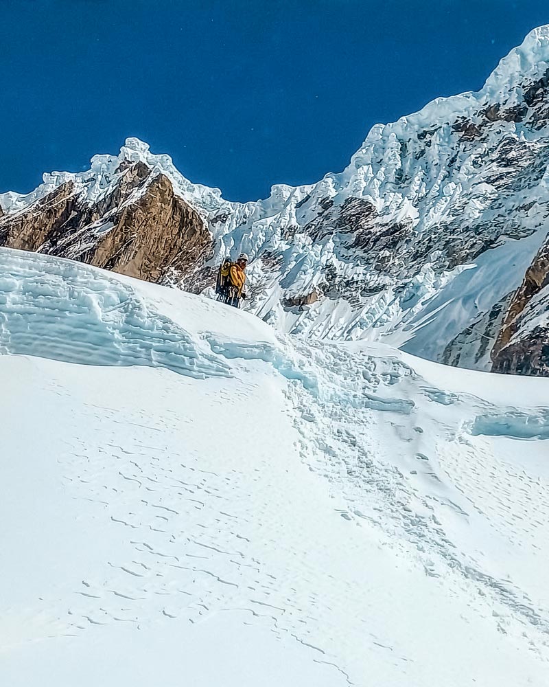 Tourist climbing Salkantay mountain