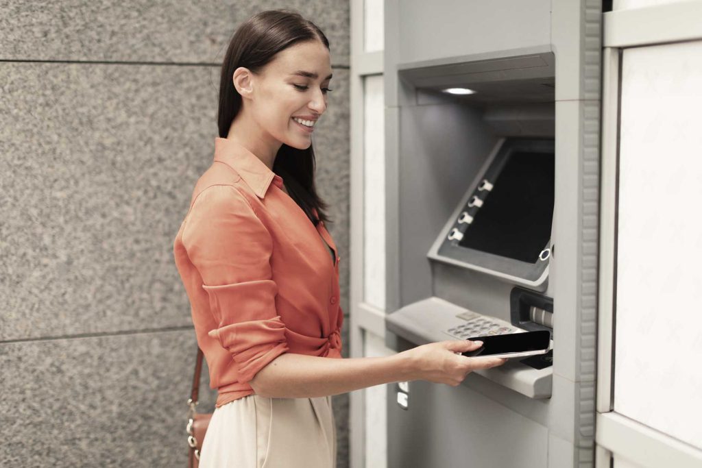 Woman using an ATM in Cusco