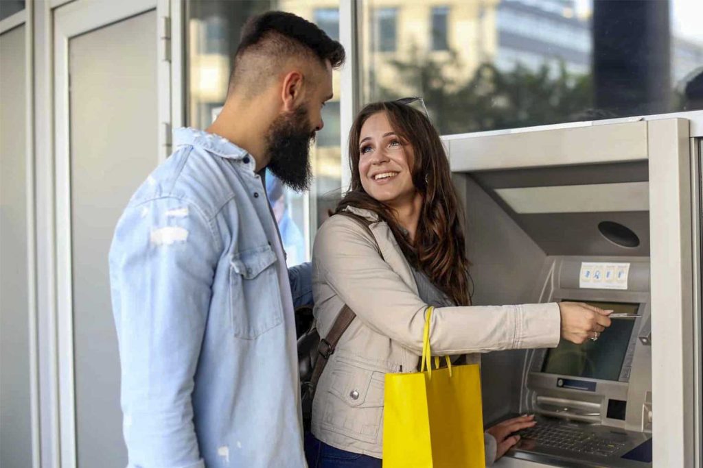 Couple using an ATM in Cusco