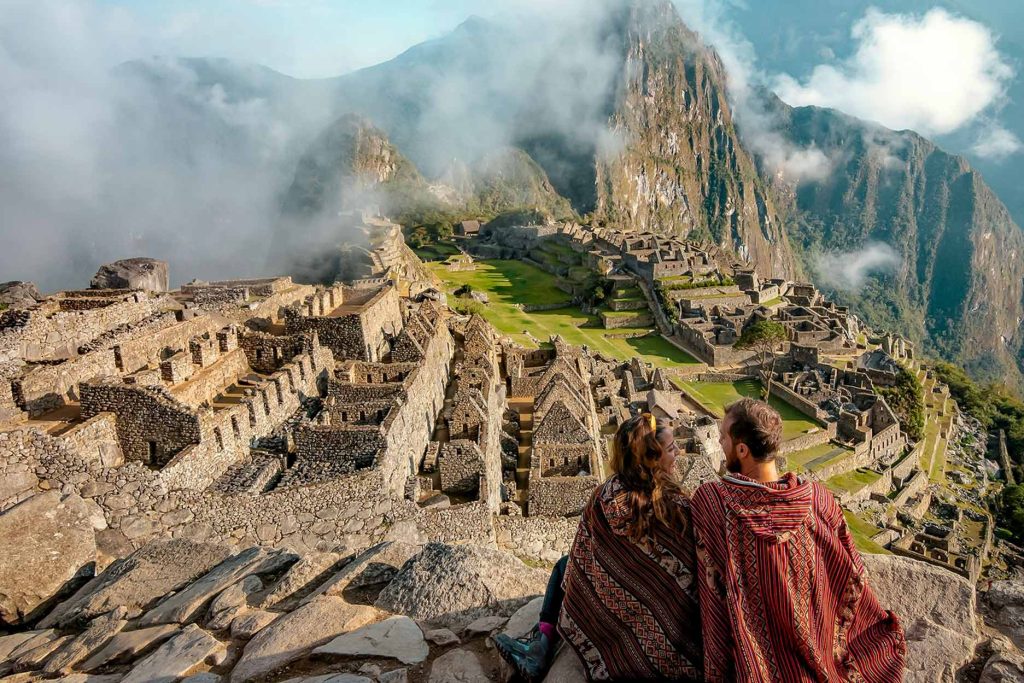 Couple in Machu Picchu at dawn.
