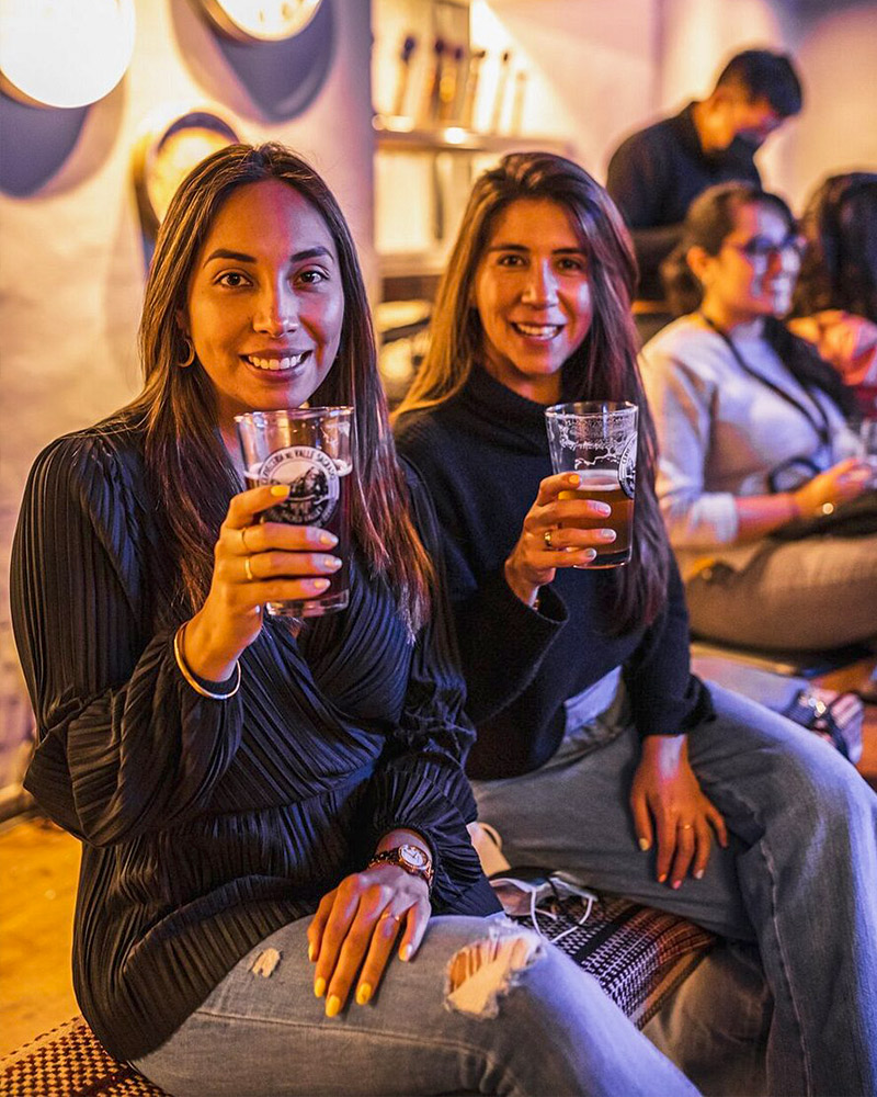 Two girls drinking craft beer in Cusco