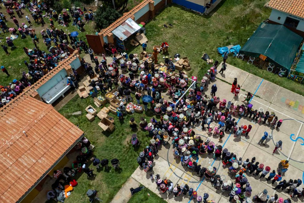 Children receiving toys and hot chocolate at the educational institution in Rodeana