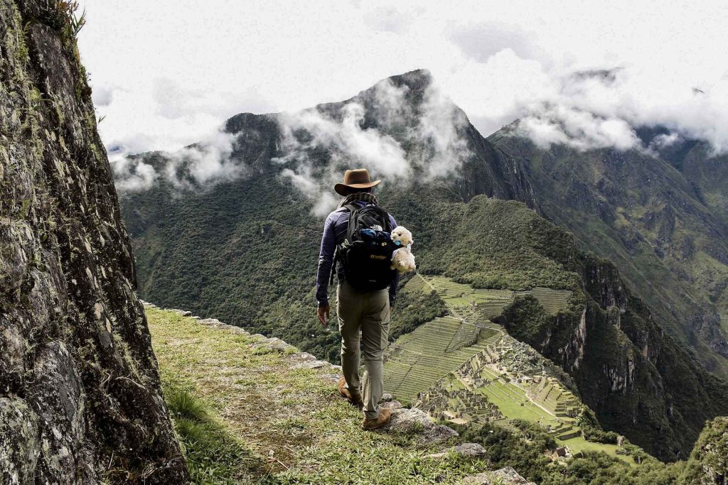 Passenger arriving at Machu Picchu via the Inca Trail during the rainy season