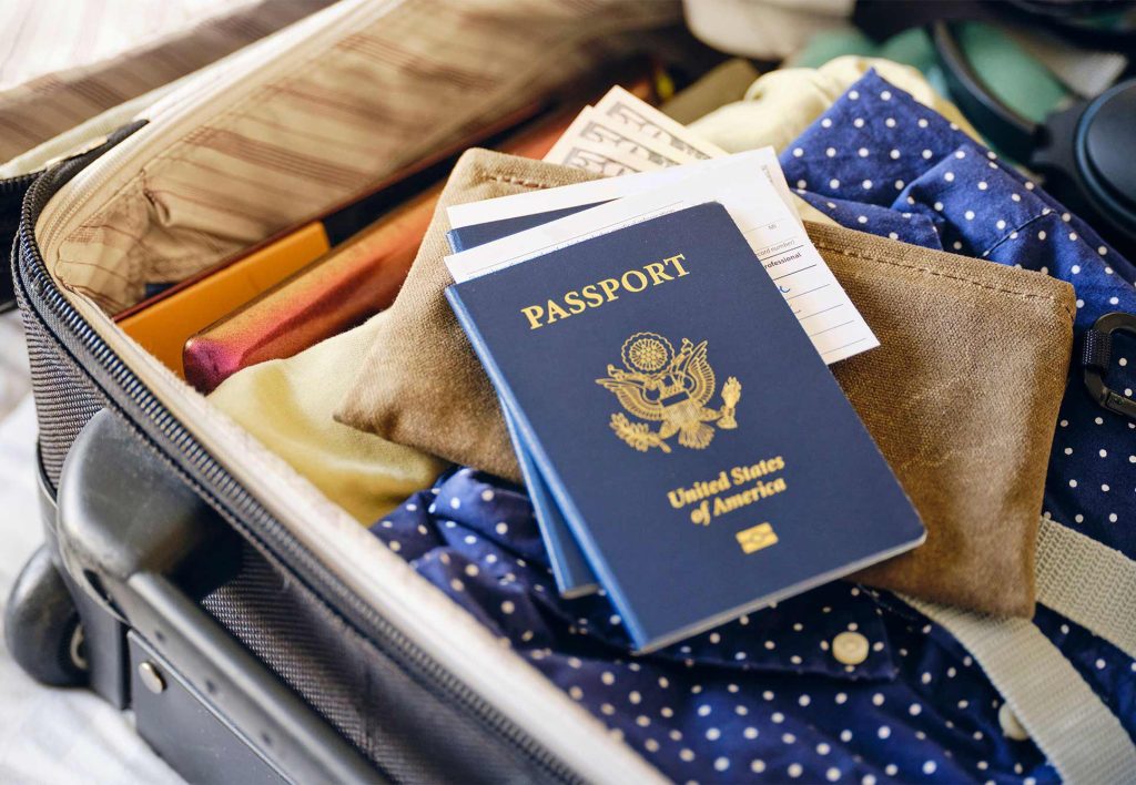 passport on suitcase for travel to Peru