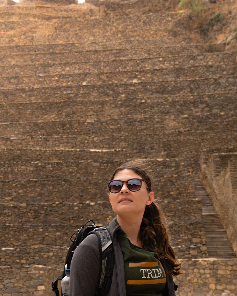 Tourist at the entrance to the archaeological site of Ollantaytambo, at the foot of the terraces