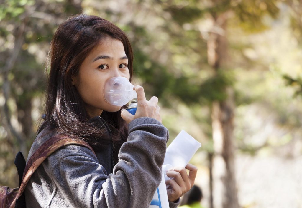 Tourist using oxygen in Cusco to combat altitude sickness