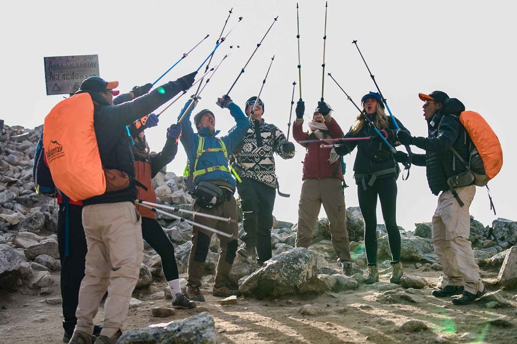 Hikers celebrating at Abra Salcantay on the Salcantay Trek