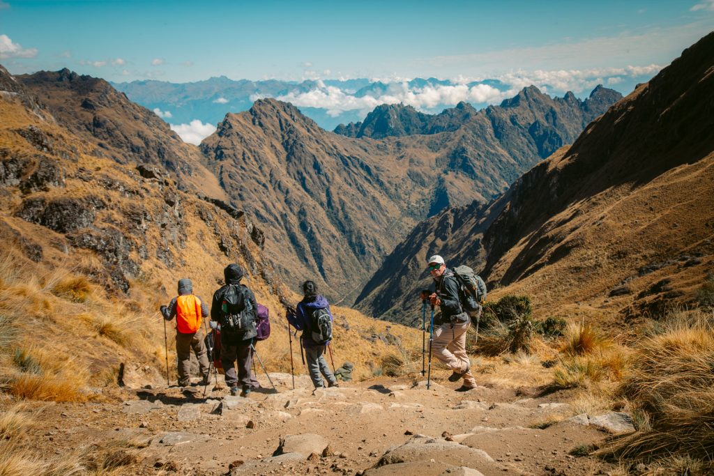 Group of tourists at the highest point of the Inca Trail.